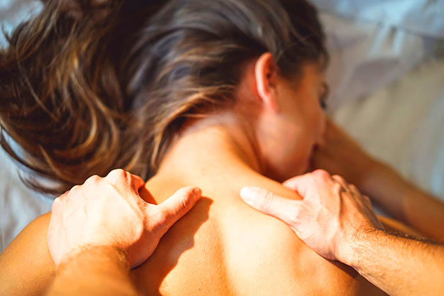 image of woman relaxing while having a massage